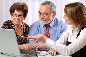 senior-couple-reviewing-living-trust-at-computer-screen-with-charlotte-estate-planner